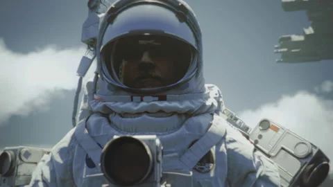 Astronaut with an open helmet shield looking at the terraformed planet with Video stock 226413508