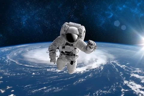 Astronaut in outer open space over the planet Earth.Stars provide the backgro Stock Illustration