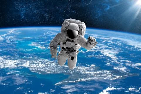 Astronaut in outer open space over the planet Earth.Stars provide the backgro Photos