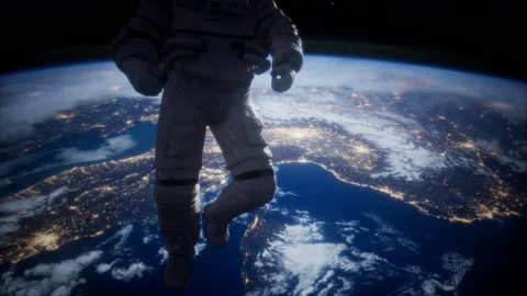 Astronaut in outer space against the backdrop of the planet earth 動画素材 125504972