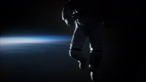 Astronaut in outer space against the backdrop of the planet earth Stock Footage 126400345