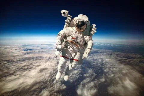 Astronaut in outer space against the backdrop of the planet earth. Elements o 스톡 사진