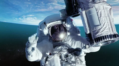 Astronaut in outer space against the planet earth. Close-up. Stock Footage 39373197