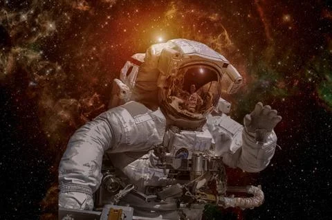 Astronaut in outer space. Elements of this image furnished by NASA. Stock Photos