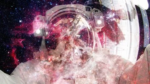 Astronaut in outer space. Elements of this image furnished by NASA. Stock Photos