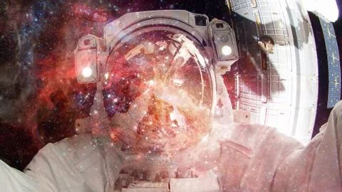 Astronaut in outer space. Elements of this image furnished by NASA. Stock Photos