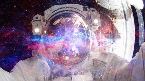 Astronaut in outer space. Elements of this image furnished by NASA. Stock Photos