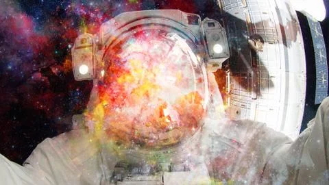 Astronaut in outer space. Elements of this image furnished by NASA. Stock Photos