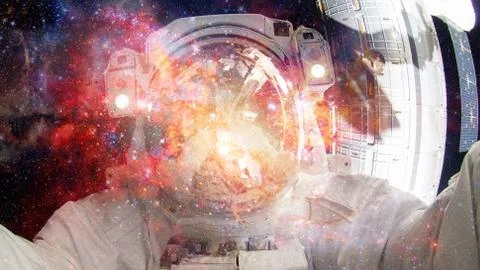 Astronaut in outer space. Elements of this image furnished by NASA. Stock Photos
