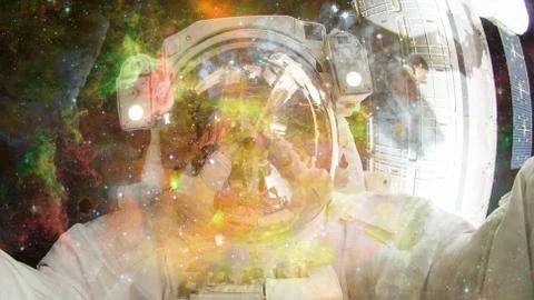 Astronaut in outer space. Elements of this image furnished by NASA. Stock Photos