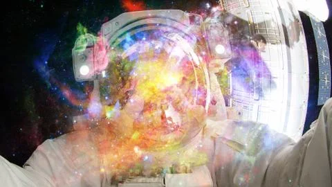 Astronaut in outer space. Elements of this image furnished by NASA. Stock Photos