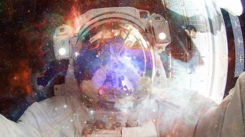 Astronaut in outer space. Elements of this image furnished by NASA. Stock Photos