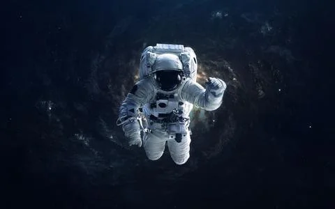 Astronaut in outer space. Elements of this image furnished by NASA Stock Photos