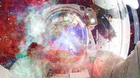 Astronaut in outer space. Elements of this image furnished by NASA. Astron... Stock Photos