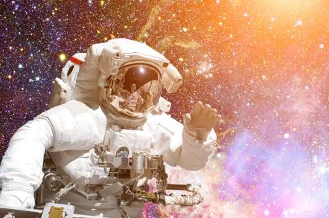 Astronaut in outer space. Galaxy and stars on the background. Stock Photos