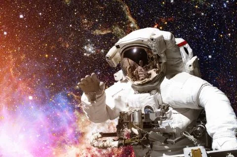 Astronaut in outer space. Galaxy and stars on the background. Stock Photos