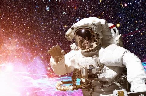 Astronaut in outer space. Galaxy and stars on the background. Stock Photos