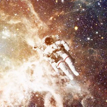 Astronaut in outer space. Nebula and stars on the background. Stock Photos