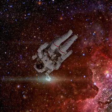 Astronaut in outer space. Nebula and stars on the background. Stock Photos