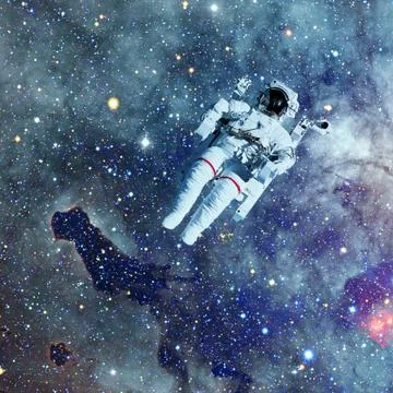 Astronaut in outer space. Nebula on the background. Stock Photos