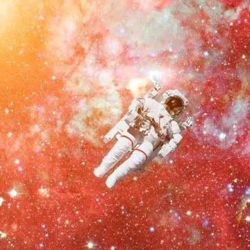 Astronaut in outer space. Nebula on the background. Stock Photos