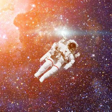 Astronaut in outer space. Nebula on the background. Stock Photos