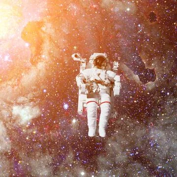 Astronaut in outer space. Nebula on the background. Stock Photos