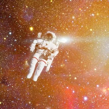 Astronaut in outer space. Nebula on the background. Stock Photos