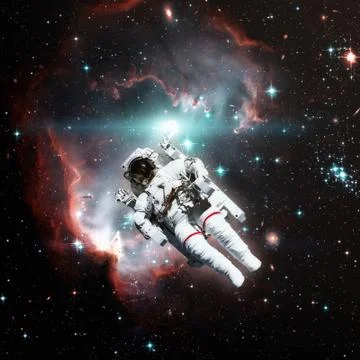 Astronaut in outer space. Nebula on the background. Stock Photos