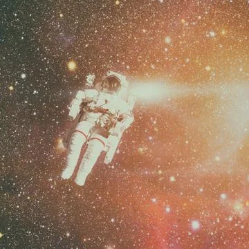 Astronaut in outer space. Nebula on the background. Stock Photos