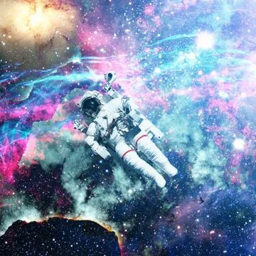 Astronaut in outer space. Nebula on the background. Stock Photos