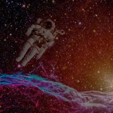 Astronaut in outer space. Nebula on the background. Stock Photos