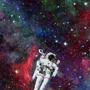 Astronaut in outer space. Nebula on the background. Stock Photos