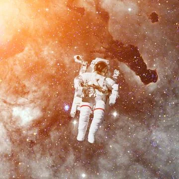 Astronaut in outer space. Nebula on the background. Stock Photos
