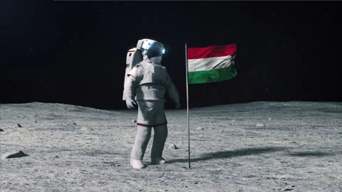 Astronaut in outer space on the surface of the moon. Planting Hungary, Hungarian Stock Footage 168337189