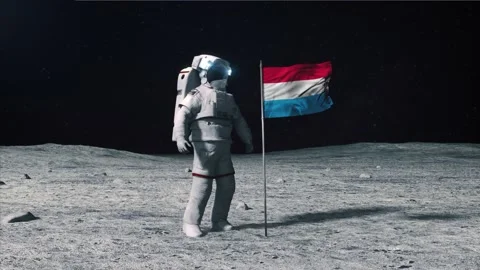 Astronaut in outer space on the surface of the moon. Planting Luxembourg flag. Stock Footage 168338639