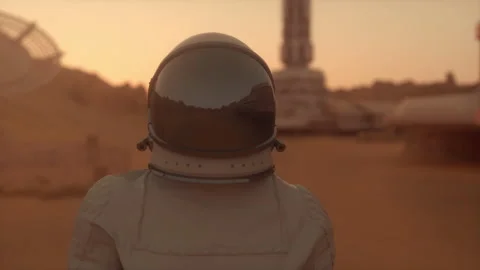Astronaut on the planet Mars. Astronaut walking on the surface of Mars Stock Footage 155542859