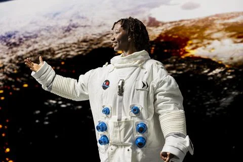 Astronaut preparing to land on outer space celestial body to analyze Mars Stock Photos