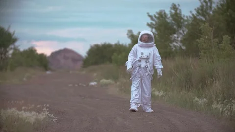 Astronaut returned to earth on the background of nature Video stock 111374143