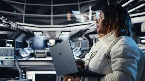 Astronaut returning from planet surface takes helmet off, talking with colleague Stock Photos
