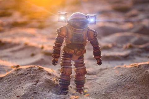 Astronaut on a sandy planet, sunset, space exploration 스톡 사진