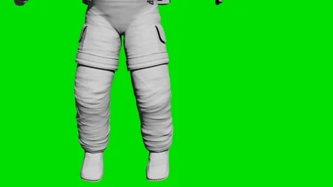 An astronaut sinks down and shows a commendable hand gesture on a green backgrou Vídeo Stock 108613811