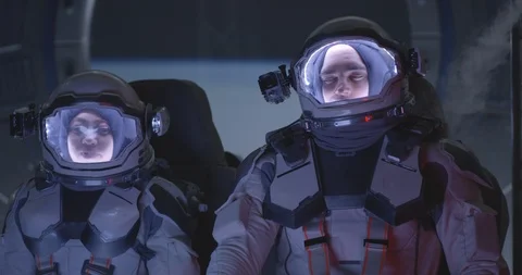 Astronaut sitting in accelerating spaceship Stock Footage 120470031