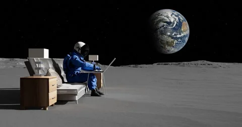 An Astronaut Sitting On A Sofa And Working With Laptop Computer. Stock Footage 253880026