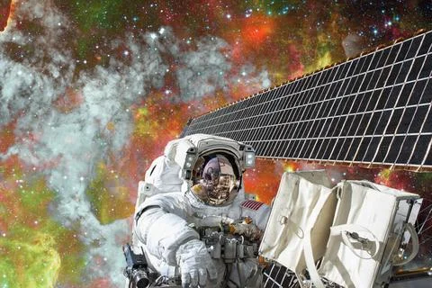 Astronaut on space mission. Elements of this image furnished by NASA. Astr... Stock Photos