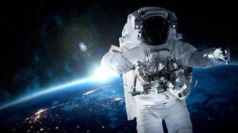 Astronaut spaceman do spacewalk while working for space station Stock Photos