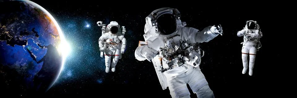 Astronaut spaceman do spacewalk while working for space station Stock Photos