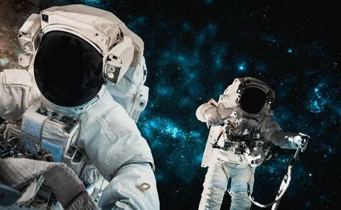 Astronaut spaceman do spacewalk while working for space station Stock Photos