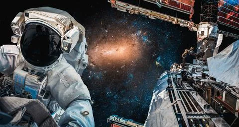 Astronaut spaceman do spacewalk while working for space station Stock Photos