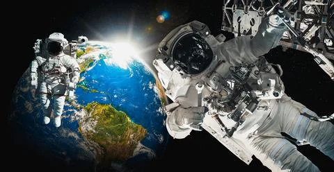 Astronaut spaceman do spacewalk while working for space station Stock Photos